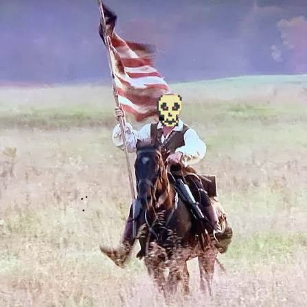 The image features a man riding a horse through a field, holding an American flag with a skull mask on his face. The caption reads "$DOG army will never surrender. We ride to spread the message of the free and fair movement. The peoples $DOG on Bitcoin." This post seems to be promoting a political or social message related to the American flag and the concept of freedom, as indicated by the skull mask.