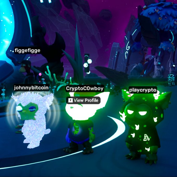 Three cartoon-style avatars stand in a colorful virtual world, with names 'figgefigge', 'johnnybitcoin', 'CryptoCOwboy', and 'playcrypto' visible above them.