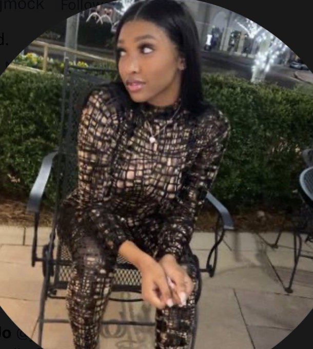 Jordan (or "Jmock"), a woman with long dark hair wearing a sheer black lace jumpsuit, is seated on an outdoor patio chair, looking off to the side. The post welcomes her as a special guest on VeVe's Affiliates Assemble Show this Thursday, presenting her in a stylish, candid portrait that aligns with her new role as a featured guest.