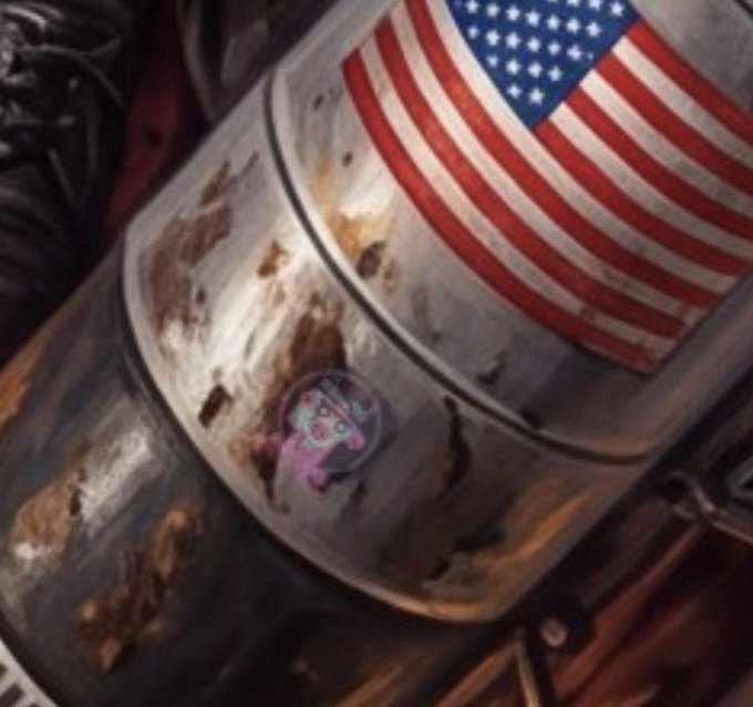 A detailed painted artwork showing a tattered, rusted, and weathered American flag with dirt and blood stains, evoking a dystopian or post-apocalyptic aesthetic.