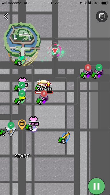 A mobile game map screen showing a city street layout with a pink player icon, green checkmarks, coin stacks, and a '767m' distance indicator near a 'DOPUICA' marker.
