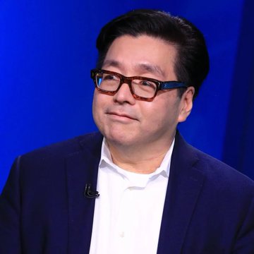 A man with glasses and a blue suit appears on what looks like a television interview set, likely Tom Lee of Fundstrat discussing Bitmine's (BMNR) recent acquisition of 9,926 ETH and substantial share buybacks totaling over 20.8 million shares since July 1.