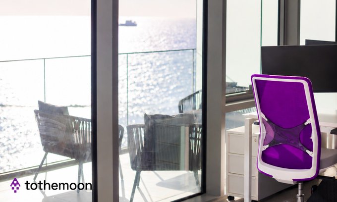 A scenic office view overlooking the ocean with a purple gaming chair in the foreground, branded with 'tothemoon' and a rocket logo.