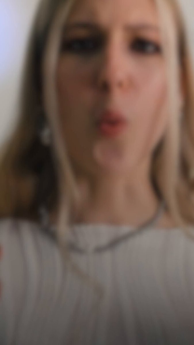 The image shows a woman with blonde hair wearing a white shirt, making a funny face as she looks at the camera. The caption below the photo provides information about the importance of building a new blockchain for institutions due to the limitations of existing blockchains. It also mentions that real blockchain technology can be used by institutions to create transparent and decentralized rails for Web3 applications.