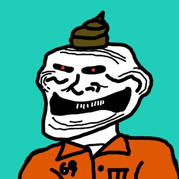 The image features an orange clown with a large brown poop on his head, wearing an orange jumpsuit and a white shirt underneath. The clown has a big smile on his face and appears to be laughing or making a funny face for the camera. There is no text present in the image, but it seems to be related to the post about the troll.