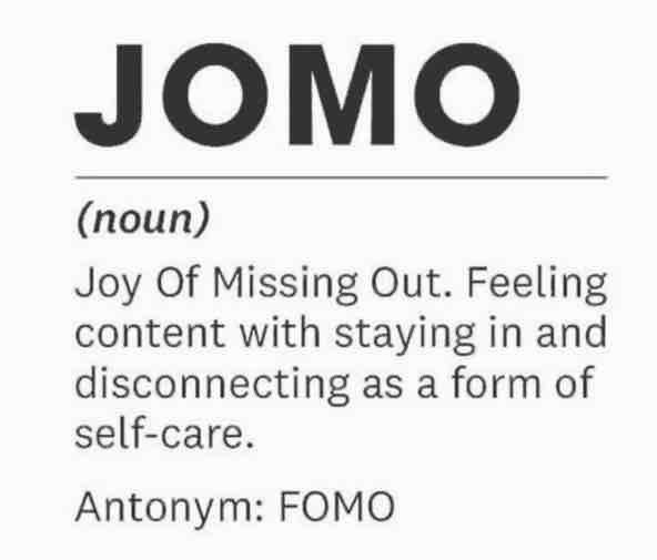 A dictionary-style definition graphic defining the slang word 'JOMO' as 'Joy Of Missing Out. Feeling content with staying in and disconnecting as a form of self-care,' with 'Antonym: FOMO' noted below.