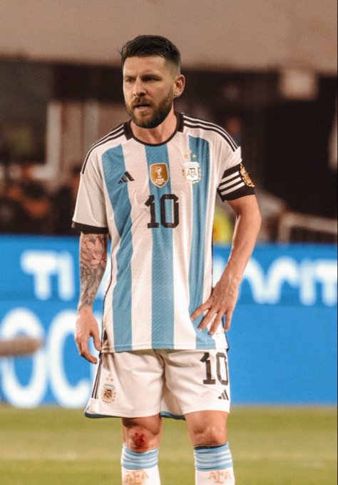 Lionel Messi wearing the Argentina national team jersey with number 10, standing on the pitch during a match.