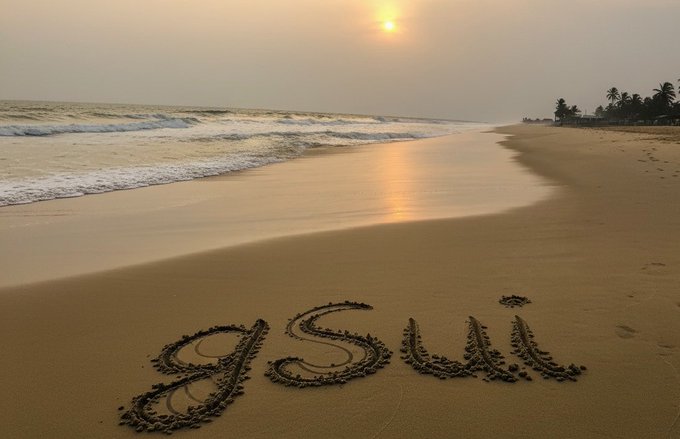 A scenic beach at sunset with gentle waves and palm trees in the distance, where the name 'gSuji' is written in the wet sand.