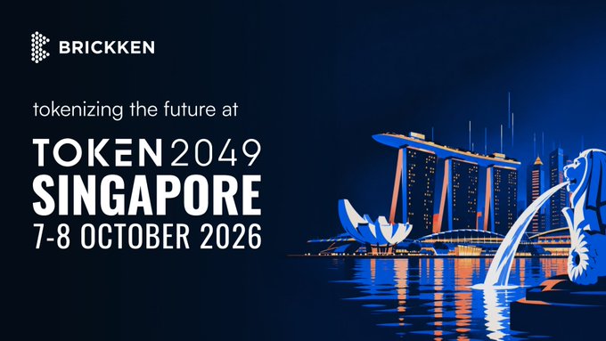 The image is a promotional graphic by Brickken announcing their attendance at TOKEN 2049 Singapore from 7-8 October 2026, featuring a nighttime view of Singapore's iconic Marina Bay Sands and Merlion statue in blue and orange tones. The post's mention of Singapore and F1 weekend aligns with the image's Singapore skyline backdrop, reinforcing Brickken's presence at TOKEN 2049 and the surrounding events in the city.