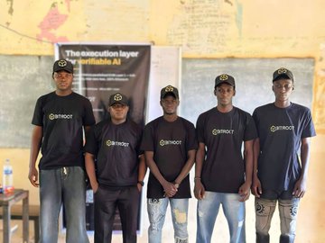 Five individuals wearing matching "Bitroot" branded t-shirts and caps stand together at the Bitroot Community Event held in Ilorin on June 14th, with a banner behind them promoting "The execution layer for verifiable AI." The image captures the hosting team who introduced students and web3 newcomers to Bitroot, a high-performance EVM compatible Layer 1 blockchain.