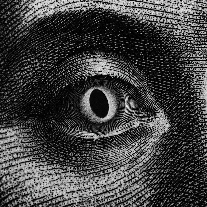 A black-and-white surreal artwork showing a detailed eye within a vortex of text-covered skin or paper, creating a hypnotic spiral effect.