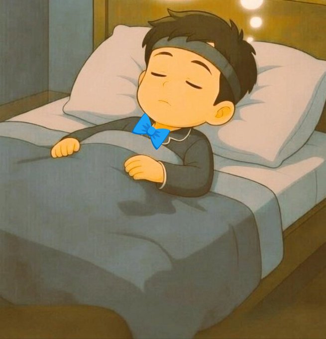 An animated illustration of a young boy sleeping peacefully in a bed with a blue headband, wearing a blue bow tie and dark pajamas under a gray blanket.