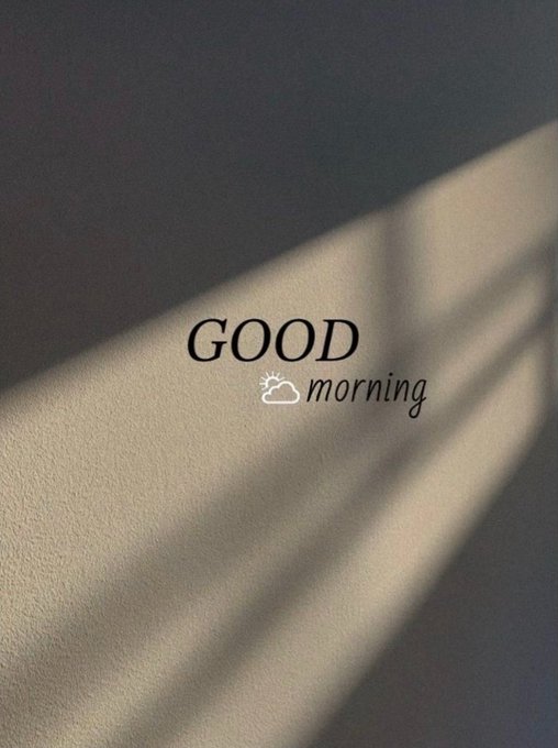 An aesthetic image shows soft sunlight casting window blind shadows across a wall, overlaid with the text 'GOOD morning' and a small sun-behind-cloud icon.