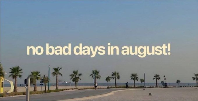 A serene beach scene at sunset with palm trees and the text overlay 'no bad days in august!' in a stylized beige font.