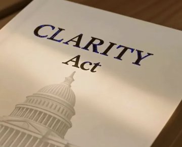 The image shows a document titled "CLARITY Act" with an illustration of the U.S. Capitol building, visually reinforcing the news post's announcement that Senate Majority Leader John Thune will bring the CLARITY Act to a Senate vote before the August recess—a development tied to the XRP community's anticipation of regulatory clarity.