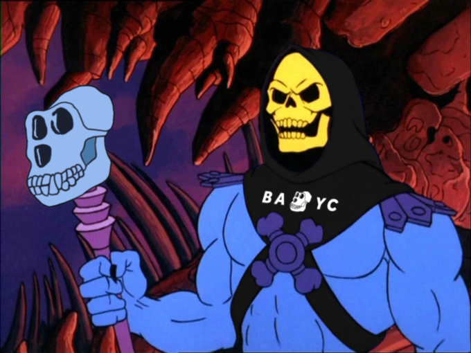 A cartoon parody of Skeletor from He-Man wearing a 'BABY YC' shirt alongside a skull-faced character.