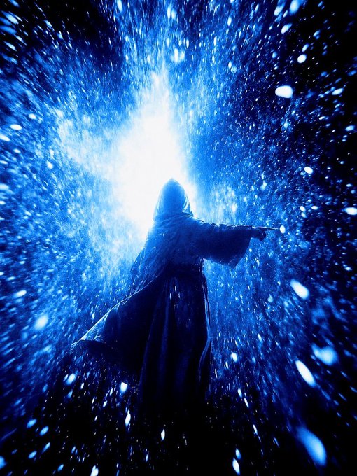 A silhouetted figure in flowing robes stands with outstretched arms against a dramatic burst of blue and white light and particles, evoking the mystical force of belief referenced in the caption "Belief makes the impossible move. @suinetwork."