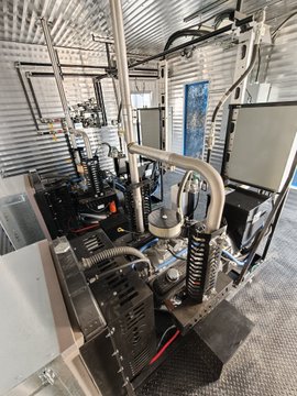 A pair of newly assembled twin Chevy smallblock natural gas generator sets sits on a factory floor, ready for deployment. The image showcases the industrial machinery that bridges the poster's passion for oil and gas with their entrepreneurial success funded by Bitcoin.