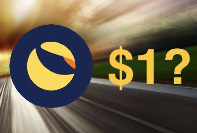 The image features a vibrant graphic with two distinct elements - an advertisement for Luntron with a yellow circle and blue background, containing the logo of the company. Below this, there's an exaggerated illustration of a road with a "$1" sign placed on top of it. The background is blurred, but you can see an open highway with grassy areas visible through the windshield.
