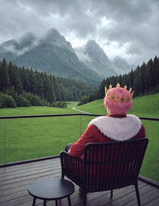 The image features a person wearing a pink crown, sitting alone on a chair with their back facing away from the camera. The scene takes place outdoors, possibly at a park or a similar setting. The person appears to be enjoying some time by themselves in nature.