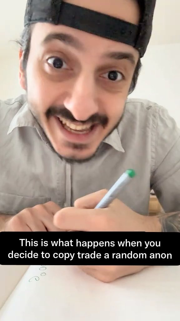 A wide-eyed man in a backwards cap grips a pen with an intense grin while writing on paper, captioned "This is what happens when you decide to copy trade a random anon," humorously illustrating the manic, reckless behavior that comes with blindly following anonymous traders on PumpFun.