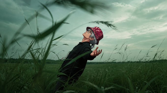 An anime-style illustration of a young boy wearing a red bandana and black shirt standing in a grassy field, looking up at a cloudy sky with his arms slightly outstretched.