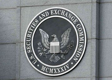 The official seal of the U.S. Securities and Exchange Commission mounted on a stone wall, featuring an eagle emblem and the Roman numerals 'MCMXXXIV'.