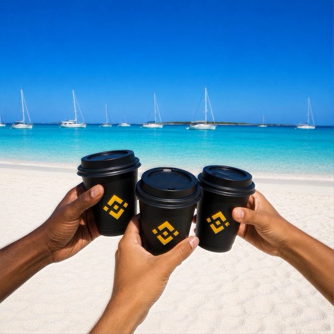 Three hands raise black reusable coffee cups bearing the yellow Binance logo in a toast on a sunny tropical beach with sailboats on turquoise water, pairing perfectly with a "Gm" greeting and a cheerful wish for a great week ahead.