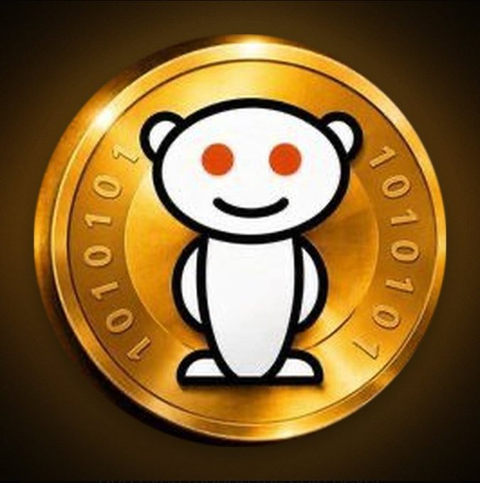 A gold-colored Reddit coin featuring the white Reddit alien mascot with binary code (101010) etched around its edge.