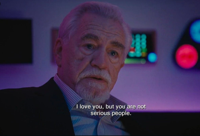 An older bearded man in a suit stands in a dimly lit room with purple and blue lighting, looking at the camera with a serious expression. The subtitle reads "I love you, but you are not serious people." The image humorously illustrates the post's context, suggesting the speaker is delivering a critical or disappointed message to the audience, fitting the tone of uncovering a serious bug in bitcoin self-custody.