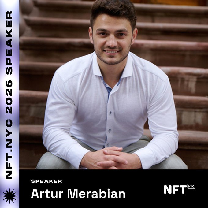 Promotional graphic featuring Artur Merabian, a smiling man in a white button-up shirt seated on stone steps, announced as a speaker for NFT.NYC 2026 alongside a branded "NFT.NYC" logo, spotlighting his work as founder of Stock Unlocked and Metaverse Unlocked Web3 studio.