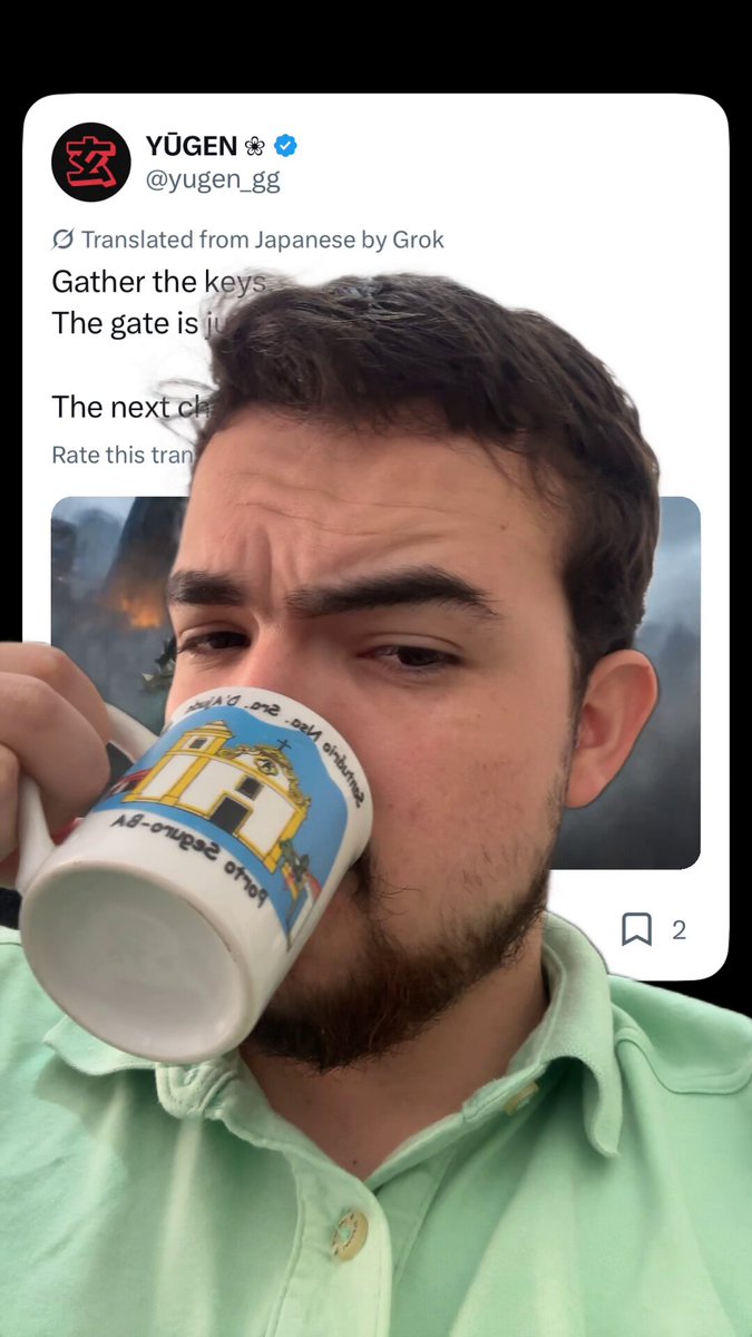 A man wearing a green shirt sipping coffee from a mug with a cartoon picture. The caption reads: "GM GM Yugen: Leaders is the Mint of the day Supply: ETH Price: 0.022 Are you minting? @yugen_gg". This image is posted in response to Yogen, who has been tagged on the post for his leadership role or contribution to the conversation.