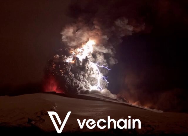 The image features a large volcano with a bright lightning bolt striking it, creating an impressive display of nature's power. The caption for the image reads "The TRUST AI Marketplace is about to ERUPT on #VeChain!". This suggests that the volcanic eruption and its accompanying lightning are part of a larger event or phenomenon related to the marketplace, possibly indicating a significant shift in the digital landscape or a new era of innovation and growth within the ecosystem.
