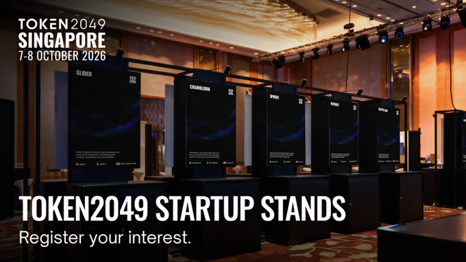 The image shows a row of branded startup stands at TOKEN2049 Singapore (7-8 October 2026), labeled from left to right as "GLOVER," "CHAIRLEADAN," "SPARK," "RIVER," and "RASCALS." The promotional graphic invites early-stage crypto founders to register their interest for the new Startup Village, which offers a stand, 5 full-access tickets, a 15-min live pitch, and investor matchmaking.