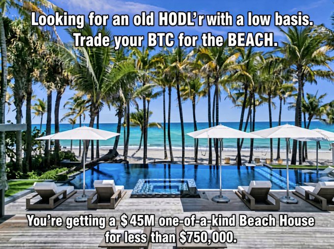 A tropical beachfront property is advertised with text reading "Looking for an old HODL'r with a low basis. Trade your BTC for the BEACH" and "You're getting a $45M one-of-a-kind Beach House for less than $750,000," offering a luxurious Miami Beach house priced at 750 BTC, targeting Bitcoin holders with low cost bases who acquired BTC before the price exceeded $1,000.