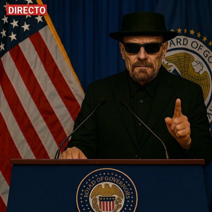 **Caption:** A man wearing dark sunglasses and a black hat and suit speaks at a podium labeled "ROAD OF GOVERNORS," with an American flag behind him and a "DIRECTO" banner in the corner, fitting the post's announcement of a live broadcast covering the FED interest rate decision and crypto analysis ($BTC, $ETH, altcoins).