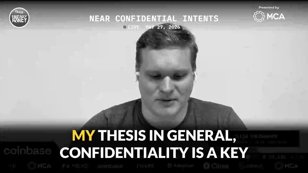 The image shows a man sitting at his computer, wearing headphones and looking down at something on his screen. The text above him reads "My thesis in general, confidentiality is a key" which seems to be related to the content of the image or the post itself.