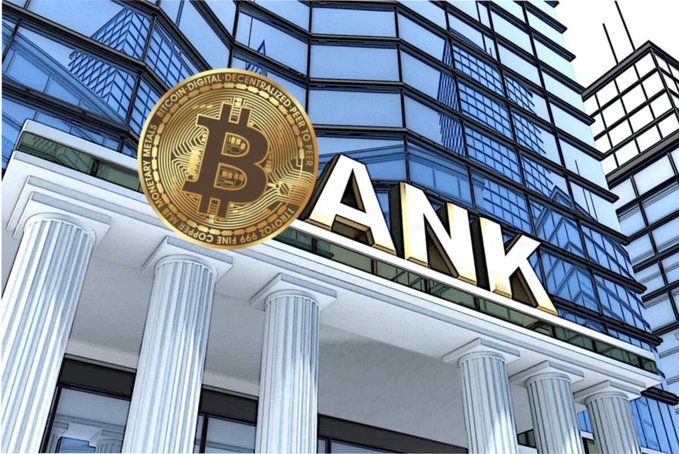 A composite image showing a large gold Bitcoin coin in front of a bank building with columns and the word 'BANK' in large gold letters on its facade.