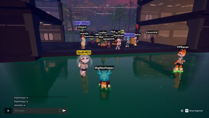 A screenshot from a virtual world game showing multiple player avatars gathered on a platform surrounded by water, with usernames like 'JayB MCV', 'BigNazHappy', and 'FFRacer' visible.
