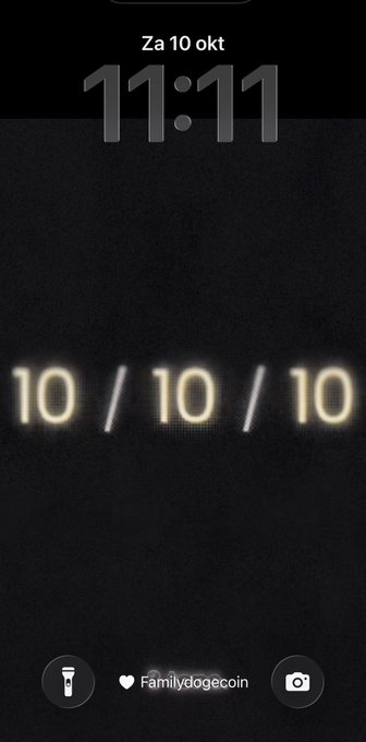 A smartphone lock screen displaying the time '11:11' and the date 'Za 10 okt' (Dutch for Saturday, October 10), with the username 'Familydogecoin' at the bottom and large stylized text reading '10 / 10 / 10'.