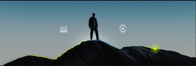 A silhouetted figure stands triumphantly atop a rocky mountain peak at sunrise, with two circular icons floating in the sky above them.