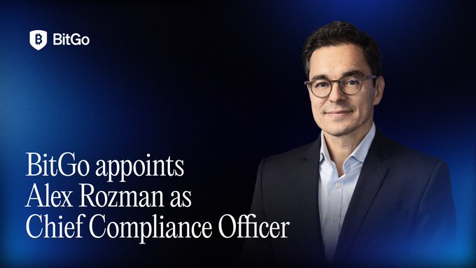 A press image announcing 'BitGo appoints Alex Rozman as Chief Compliance Officer,' showing a man with glasses in a suit against a dark blue background with the BitGo logo.