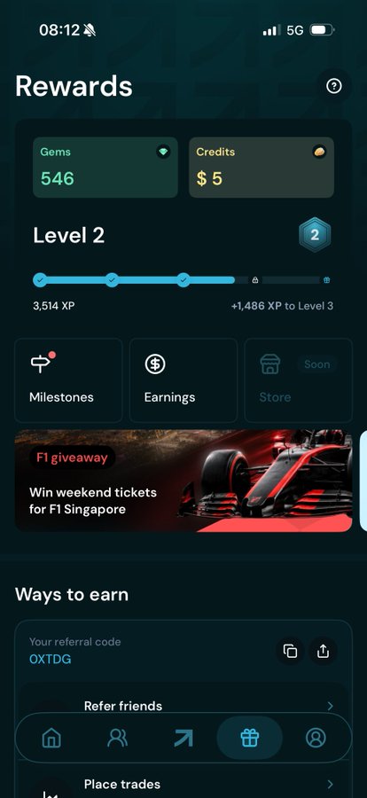 A mobile rewards screen displaying 546 Gems and $5 in Credits at Level 2 with 3,514 XP earned toward Level 3, featuring an F1 Singapore giveaway promotion and referral code OXTDG. The image supports the caption by showcasing a trading app's gamified reward system, highlighting the perks users can earn through mobile trading.