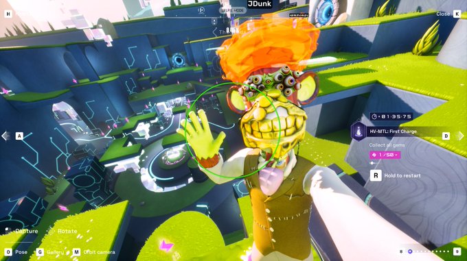 A first-person view of a video game showing a wild, multi-eyed creature with orange hair and a wide grin in a 3D obstacle course environment, with 'HW-MTL: First Charge' text and a 'Collect all gems' objective visible.
