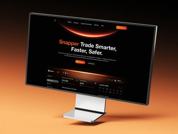 A monitor displays the "Snapper" website homepage with the tagline "Trade Smarter, Faster, Safer," featuring a dark orange cosmic design and a dashboard preview showing values like "214,402" and "0.612."