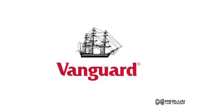 The image displays the Vanguard logo, featuring a classic black sailing ship illustration above the company's name in bold red lettering, with a small "MERLIN THE TRADER" watermark in the bottom right corner. This iconic branding visually anchors the post's message about the traditionally conservative $9 trillion asset management giant making a surprising pivot into cryptocurrency strategy and regulatory advocacy.