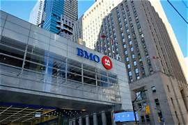 A photograph of the BMO (Bank of Montreal) building exterior with its logo visible above the entrance in an urban setting.