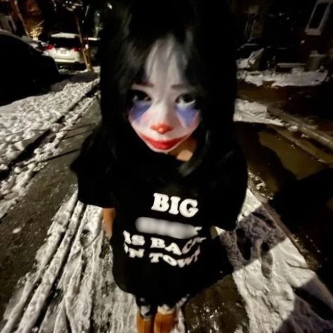 A person in Joker-style makeup with smeared face paint stands on a snowy street at night, wearing a black shirt reading "BIG ___ IS BACK IN TOWN" — fitting the meme's chaotic, unhinged energy about $Clussy going "much much much higher."