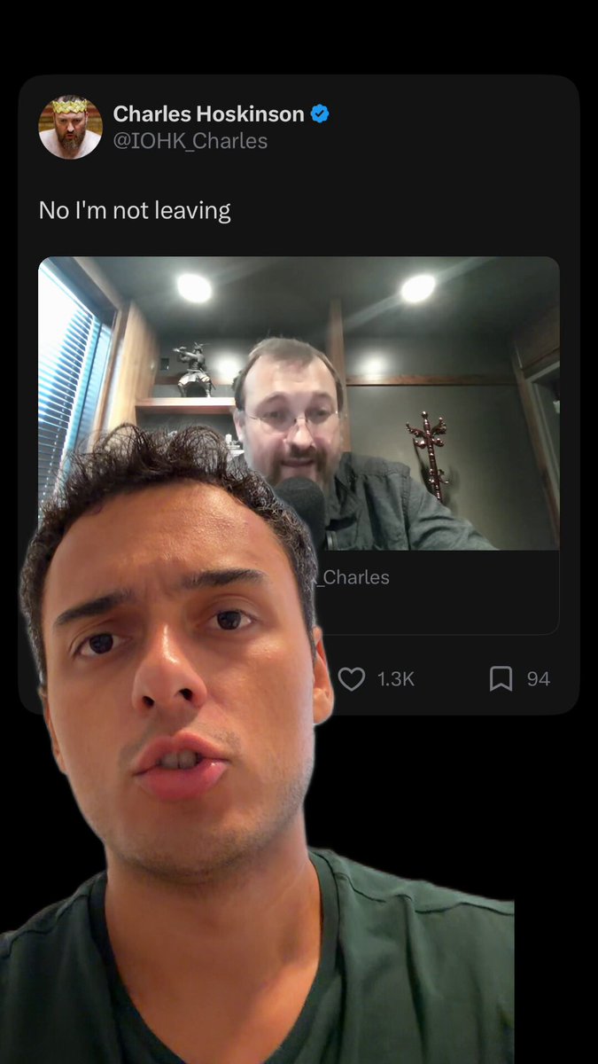 The image shows two men, one wearing a green shirt and the other wearing a brown shirt, both looking at their phones with expressions of concern or worry. They are standing against a black background that highlights the details of their faces and the screens of their devices. The man in the green shirt has a post on social media about the Crypto industry, which seems to be causing some issues for the projects within it.