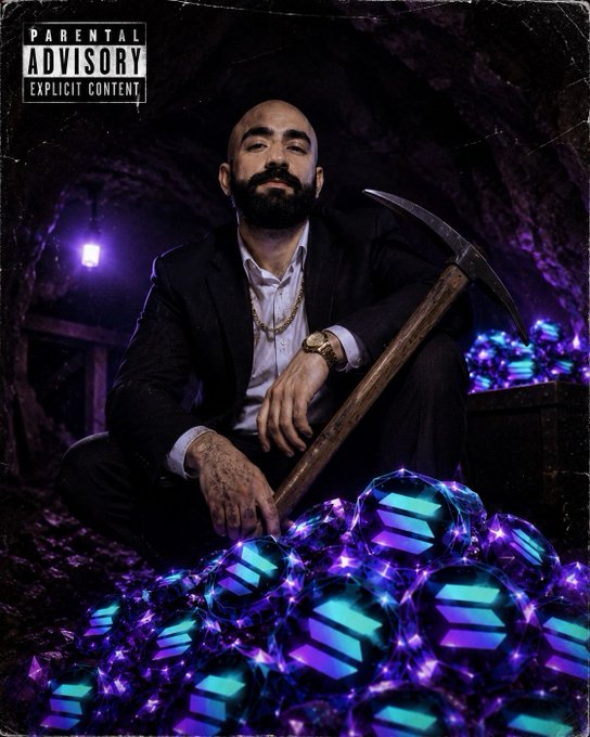 Album cover or promotional image showing a bearded man in a black suit holding a pickaxe, sitting among glowing purple crystals in a dark mine, with a 'Parental Advisory Explicit Content' label.